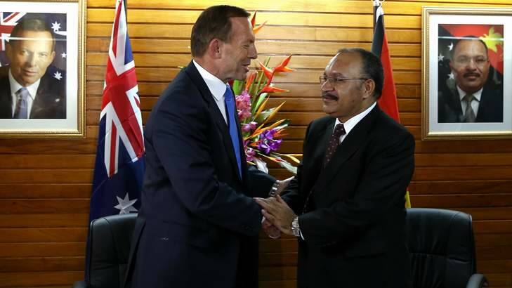 Backflip of refugee resettlement: Prime Minister Tony Abbott and PNG Prime Minister Peter O'Neill. Photo: Alex Ellinghausen