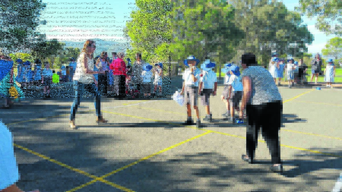 Donna Graham and Evonne Sherwood battle it out on the handball court. The chief umpire of the game was Tyler Swift.
