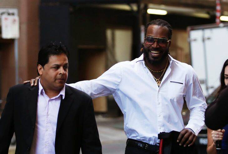 West Indies' Cricket player Chris Gayle (right) arrives at the NSW Supreme Court in Sydney on October 24, 2017.  (Photo by Daniel Munoz/Fairfax Media)