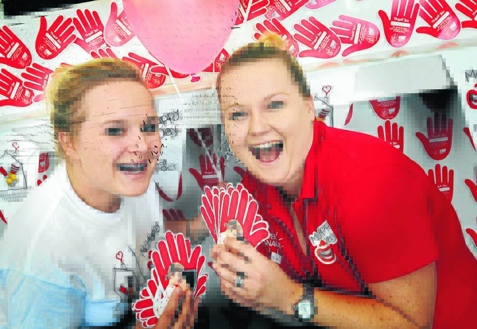 MILES OF SMILES: Gearing up for a massive McHappy Day in Tamworth today are Stephanie Wilson and Emily Crompton. Photo: Geoff O'Neill 171014GOB01