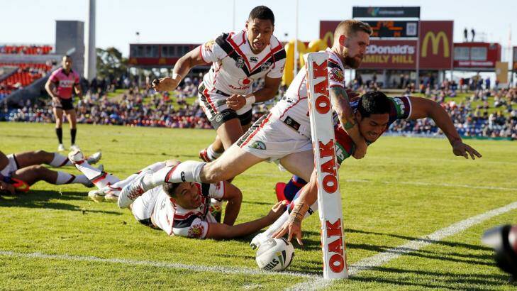 Barely there: Sione Mata’utia scores on Sunday. Photo: Jonathan Carroll