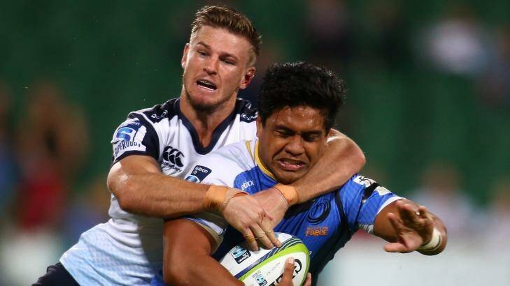 Tough year out west: Waratahs winger Rob Horne tackles Western Force's Ben Tapuai. Photo: Paul Kane