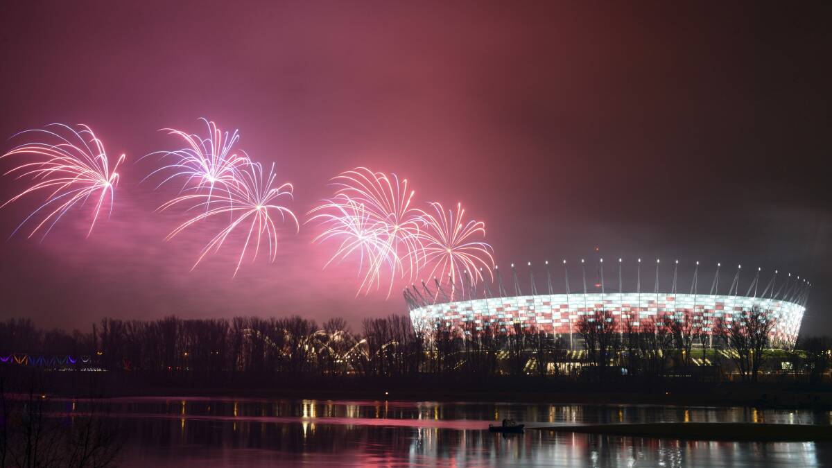 POLAND: Fireworks explode next to the National Stadium during New Year celebrations in Warsaw. Photo: REUTERS