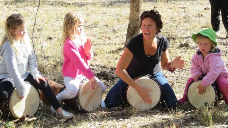 Students and African Drumming facilitator Dani Perry get in the beat.