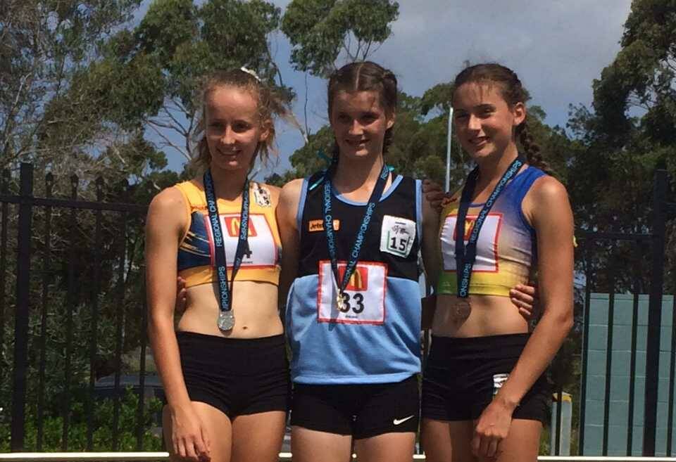 PLC Armidale’s Glen Innes boarder Gracie Martin, middle, has been in outstanding form on the running track