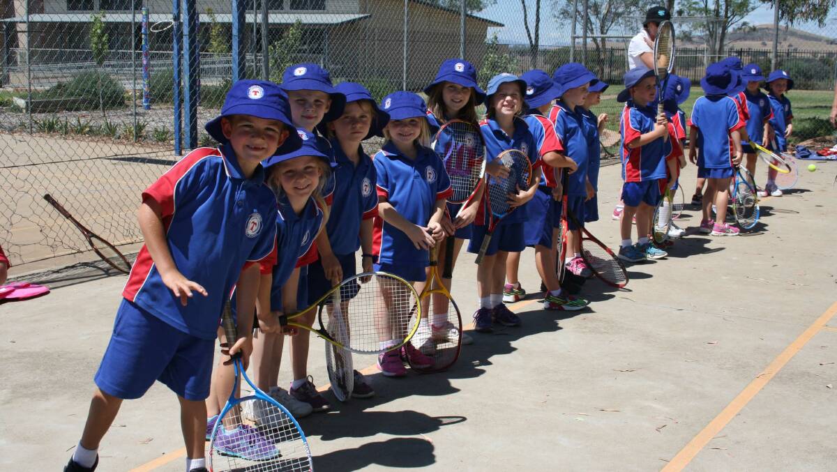 Timbumburi kindergarten students ready and waiting for tennis lessons to start