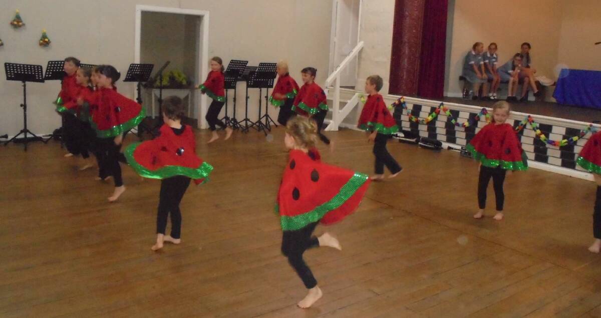 Currabubula's junior room danced to Glorious Food dressed  as watermelons