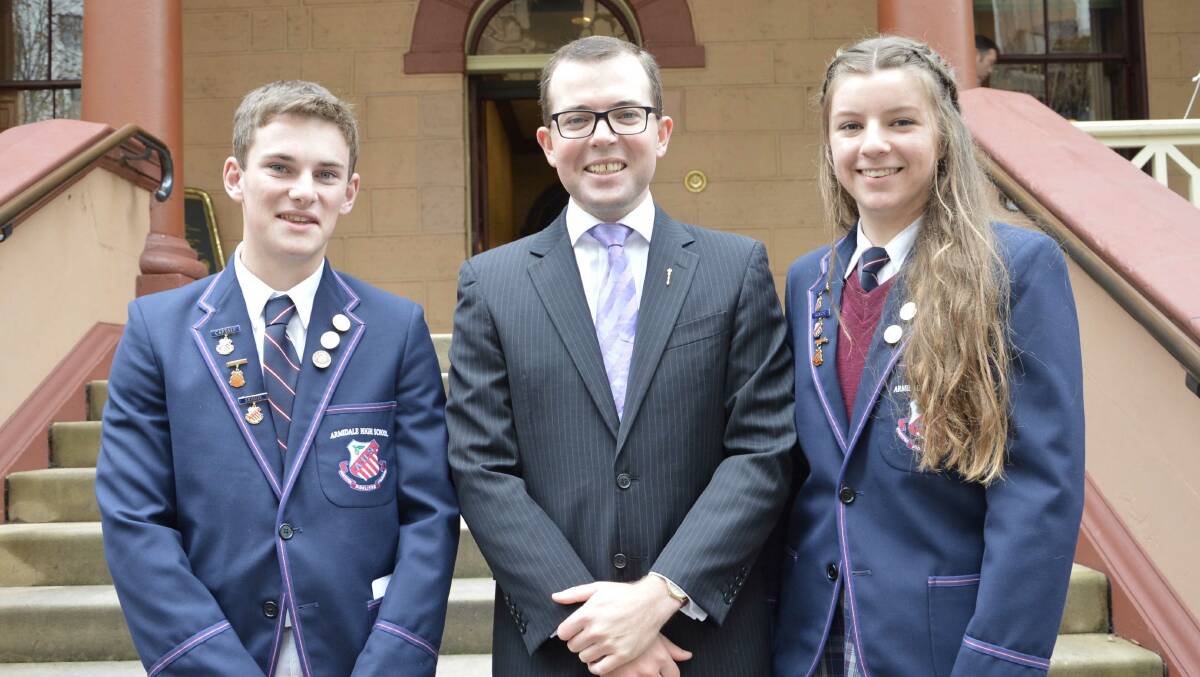 Northern Tablelands MP Adam Marshall n the steps of State Parliament with Armidale High School captains Joshua Lisle, left, and Georgina Sindel.