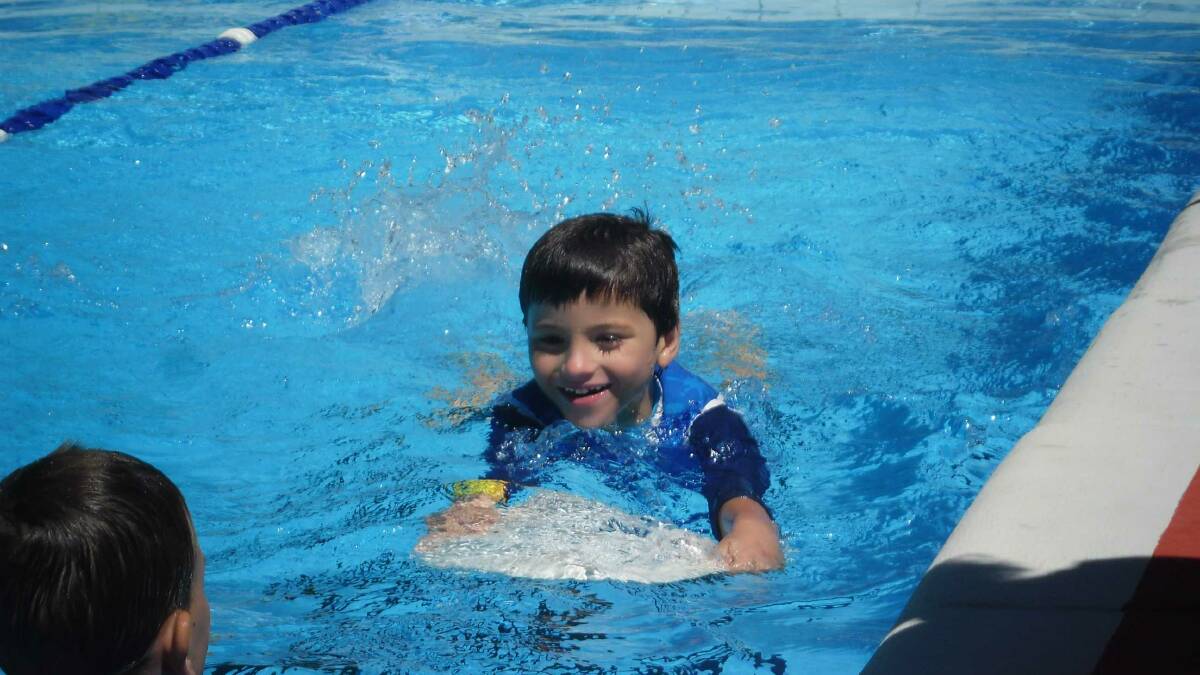 Dungowan kindergarten student Geoffrey Rumbel increased his water confidence in the school's end of year swimming program