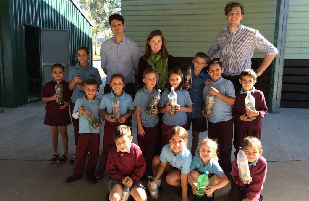 Walhallow students and the EnviroCom team with the mini composts the children made.