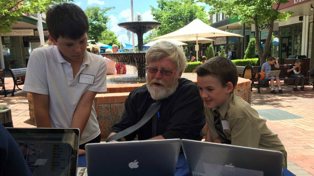 TAS Director of IT Martin Levins and students Lachlan Costello and Lachlan Hunt explore the possibilities of digital technology in the Armidale mall