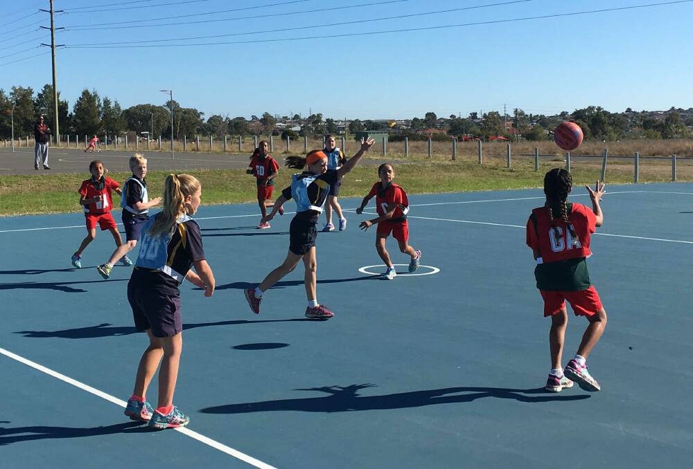 The on court action during a Saturday afternoon Hillvue Hotshop netball game.