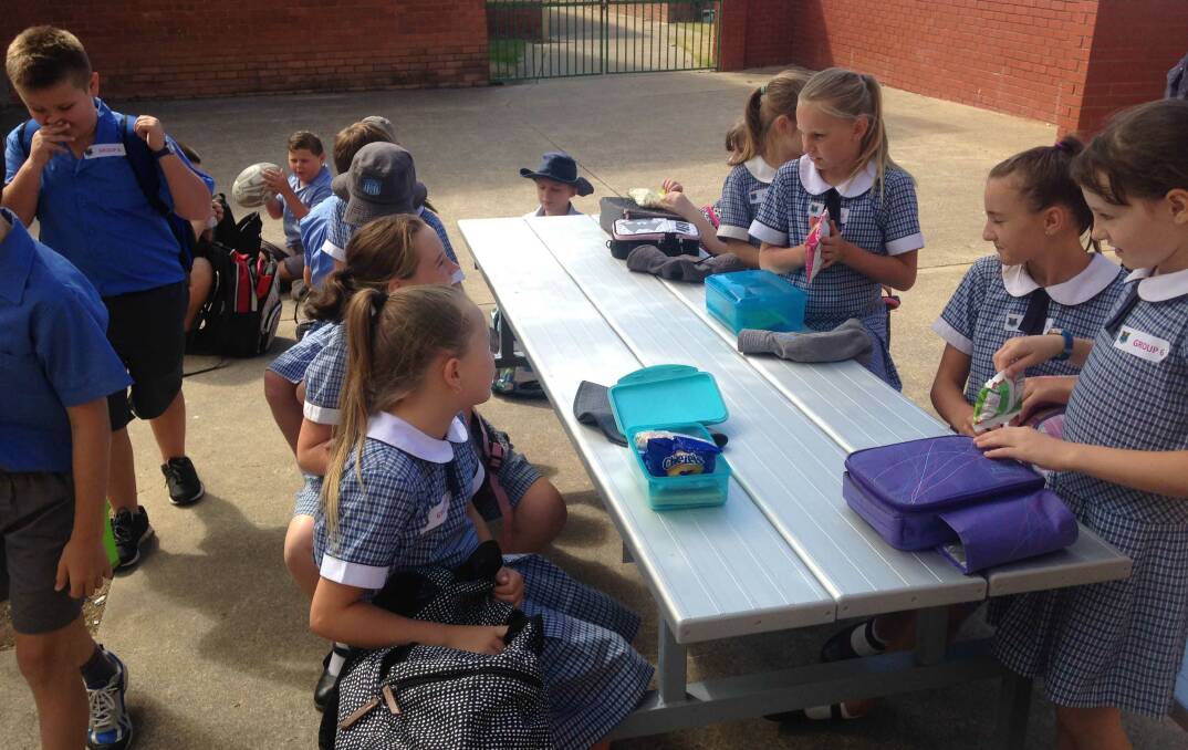 Kootingal year 4 and 5 students take a break during their visit to Tamworth High School