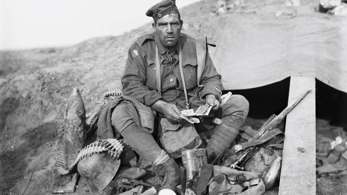 Barney Hines surrounded by German souvenirs after the Battle of Polygon Wood