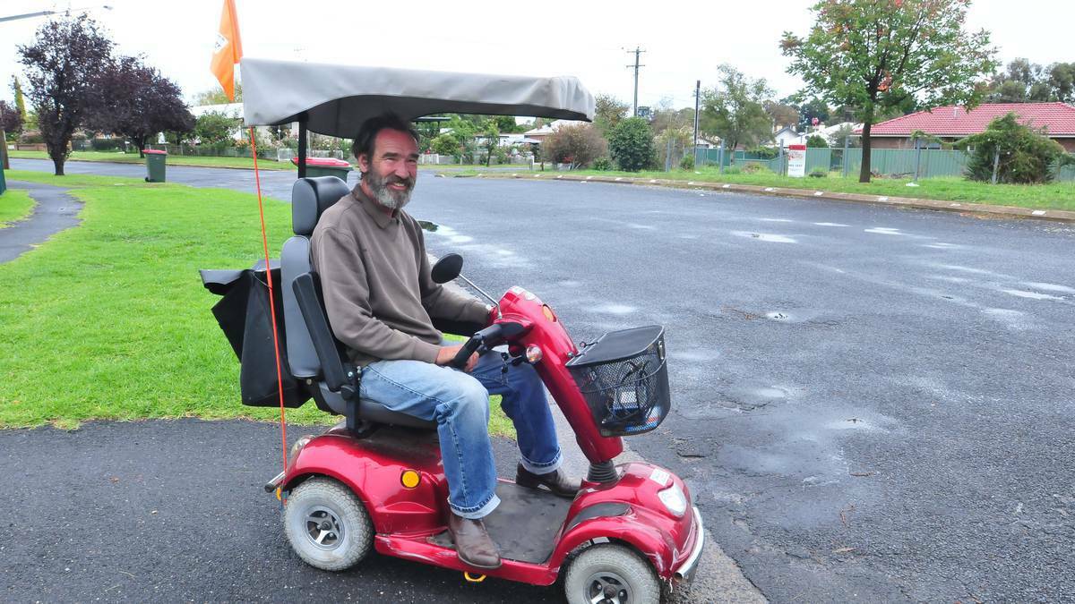ORANGE: Disability pensioner Johann Jonkmans says he is disgusted that four youths who tried to push him and his mobility scooter on to a busy section of Bathurst Road late last year have gone unpunished. Western Advocate.