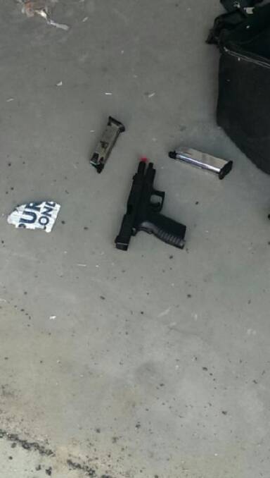 UNDER ARREST: Two replica pistols and ammunition magazines were seized during raids in Armidale this week by officers attached to Strike Force Ansae. Photo: NSW Police