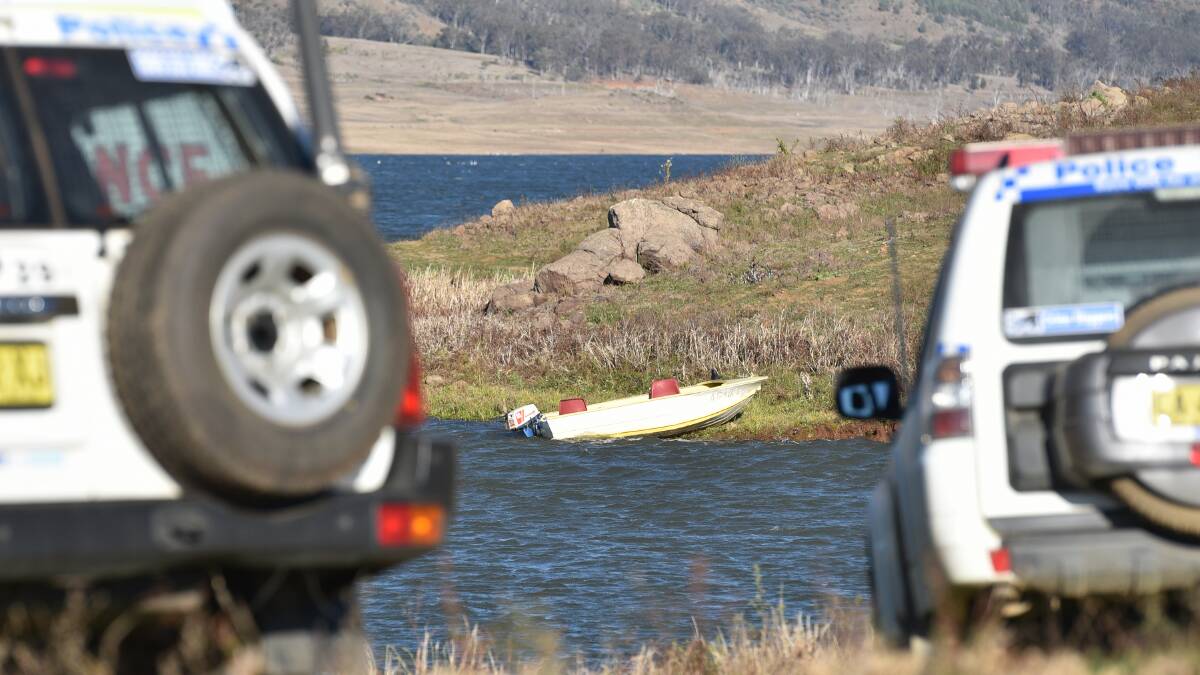 Police at the scene of the search at Split Rock Dam on Wednesday afternoon. Photo: Geoff O'Neill