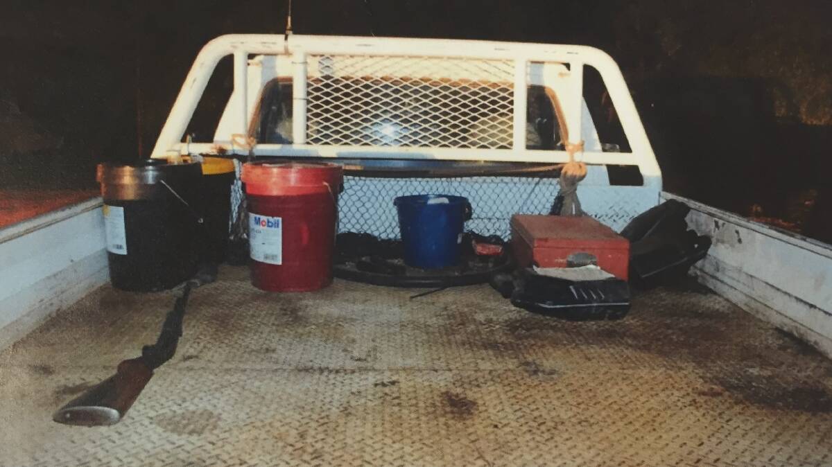CRIME SCENE: View showing the .22 Cal Browning pump action rifle and the contents of the rear tray area of the white diesel Turbo Diesel Utility. Photo: NSW Police