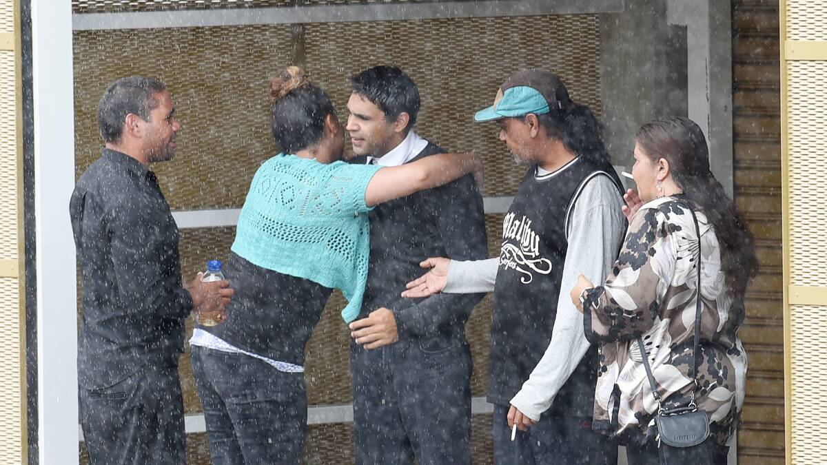 NO JAIL: Pictured from left, Brian Boney watches as Judith and Samuel Boney hug and congratulate one another, after they escaped fulltime imprisonment, outside Armidale District Court last Thursday. Photo: Gareth Gardner 280116GGA08
