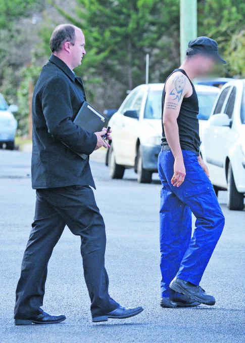 CAUGHT: Detectives at the scene of one of the raids in Armidale yesterday morning following the 29-year-old’s arrest. Photo: Barry Smith 300615BSD12