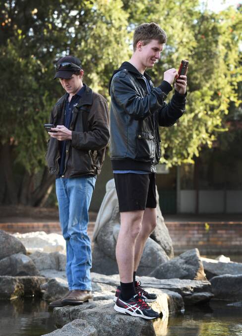 CRAZE HITS TOWN:  Daniel Lee and Mitchell Parker have harnassed the popularity of Pokemon Go, starting a Facebook page to act as a forum for local players. 
Photo: Gareth Gardner 110716GGC11