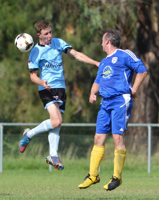 Tamworth FC’s Travis Beard heads this ball away against Moree. Beard and FC are off to Wee Waa today to play their washed-out game from the first round.  Photo: Barry Smith 050414BSF16
