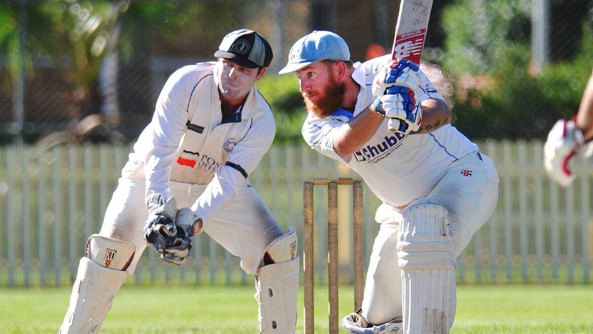 Simon Norvill drives a spinning delivery during the grand final. Norvill was named man of the grand final and, with his teammates, dominated Friday night’s presentation. Wicketkeeper is Country star Tom Groth. 
Photo: Geoff O’Neill 300314GOE02