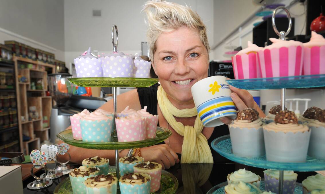 SOMETHING’S BREWING: Karryn Davis from Teamo Teahouse with some of the sweet treats it sold for the Biggest Morning Tea fundraiser. Photo: Geoff O’Neill 010514GOA01