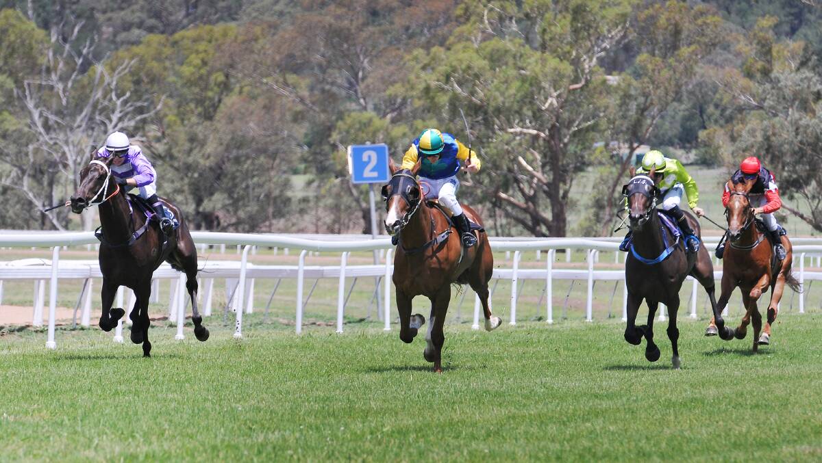 Bright Moon Night (second from left) surges home to win the first at Quirindi yesterday. Photo: Gareth Gardner 261214GGD10