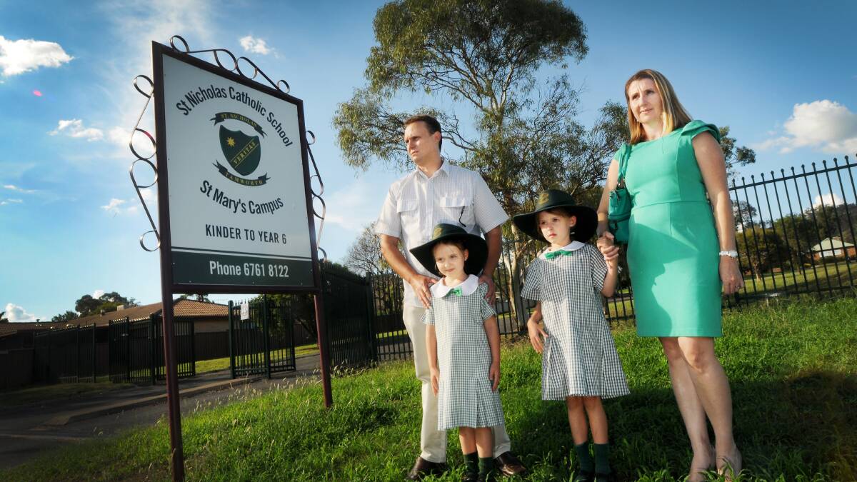 SCHOOL'S OUT: Oxley Vale parents Andrew and Caitlan Myers with daughters Sophie and Jude are protesting a move to close the St Mary's campus of St Nicholas' Primary School. Photo: Gareth Gardner 030414GGC01