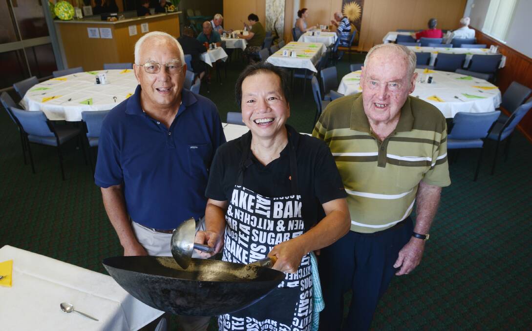 FOOD, GLORIOUS FOOD: Oxley Bowling Club has launched a new Chinese restaurant in a bid to salvage its operations. From left: John Corcoran, Rick Tan and Jack Woolaston (patron and life member) gear up for the start of service on Thursday. Photo: Barry Smith 030414BSA01