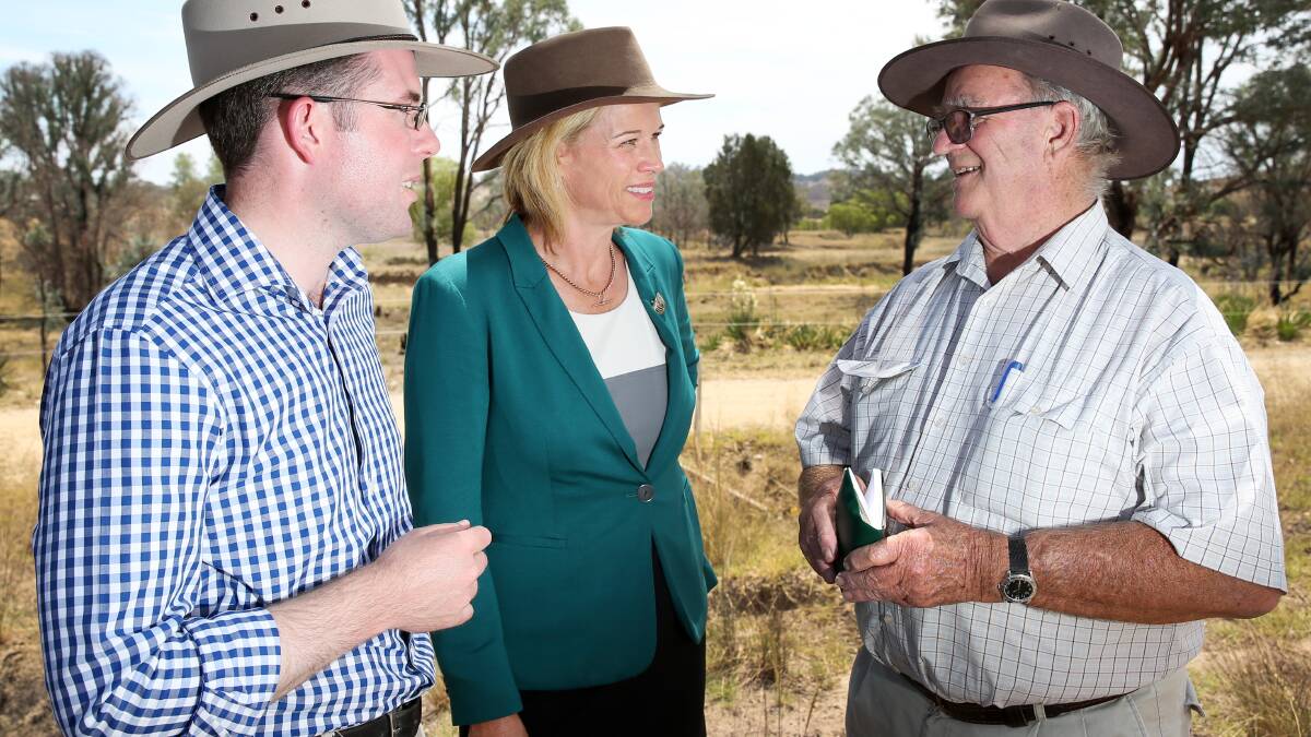 TOUGH TALK:  Agriculture Minister Katrina Hodgkinson, centre, with local MP Adam Marshall, speaks with Kingstown grazier Jim Swales from Woodlands yesterday about the drought. Photo: Matt Bedford