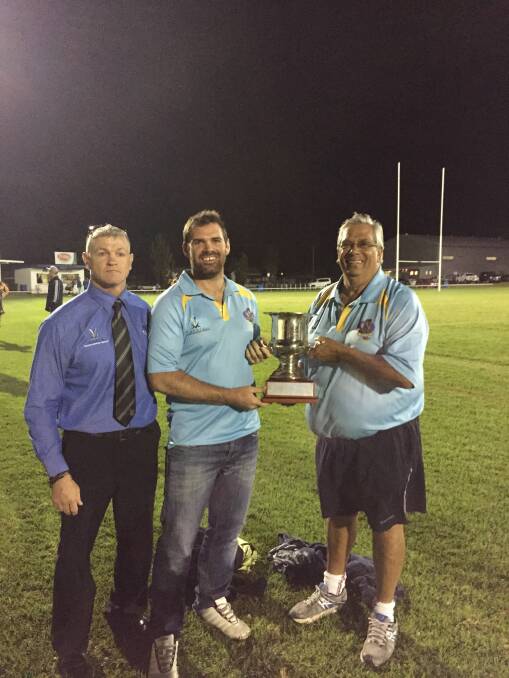 Group 4 president Mick Schmiedel (left), captain Lachlan Cameron (middle) and coach Wayne Griffiths with the Jim Sharpe Cup.