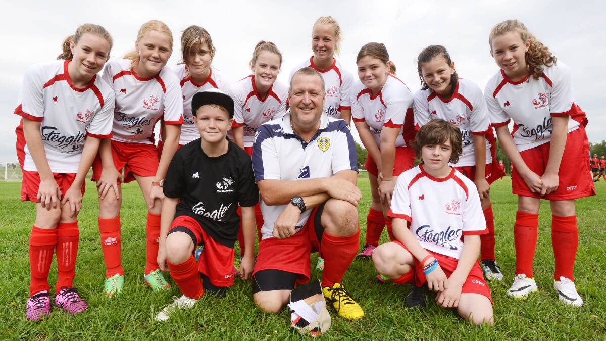 Manilla Football Club Hornets president Richard Nunn (front centre) with some of the Hornet juniors (front from left) Charlie Nunn, Richard Nunn, Taison Grainger. (Back from left) Isabelle Ford, Finlay Harry, Maddy Simon, Chicayna McNay, Georgia Spires, Murlie Ison, Katie Taylor,  Charlotte Ford. Absent: Becky Beaton and Phoebe McLoughlin.  Photo: Barry Smith 050414BSC02