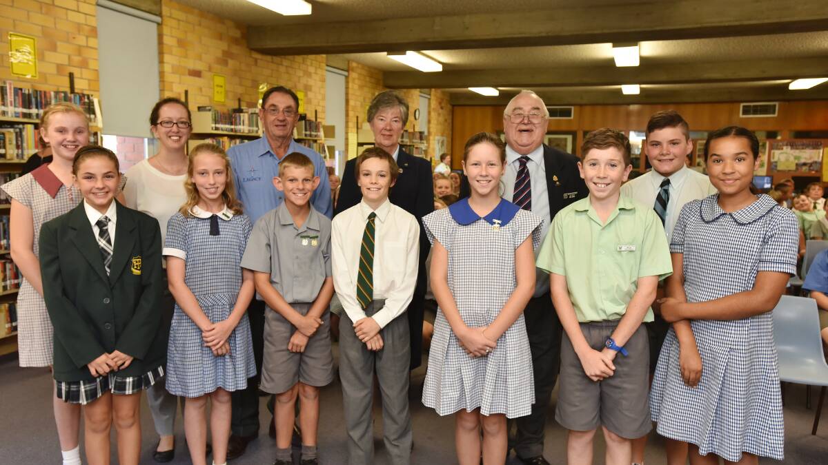 KEEPING SPIRIT ALIVE: Front from left, Peel High’s Maia Olrich, Ebiny Philpott from Kootingal Public School, South Tamworth Public School’s Tobias Kirk, Josiah Cooper from Farrer, Emily Pring from West Tamworth Public School, St Nicholas’ School’s Bill Tydd and Keeley Hay from McCarthy Catholic College. Back from left, Finella Palmer from Nemingha Public School, co-ordinator Casey Deaves, Legacy’s Laurie Hoad, Tamworth RSL Sub-branch’s Anne Lane and Errol Bourne and Tamworth High School’s Jye Taggart. Photo: Geoff O’Neill 260315GOD01