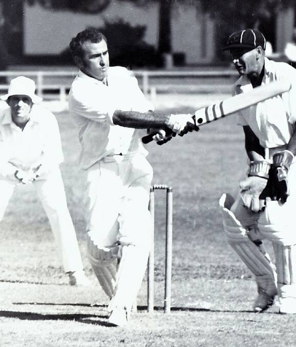 Dennis Madden hitting out on the cricket field.