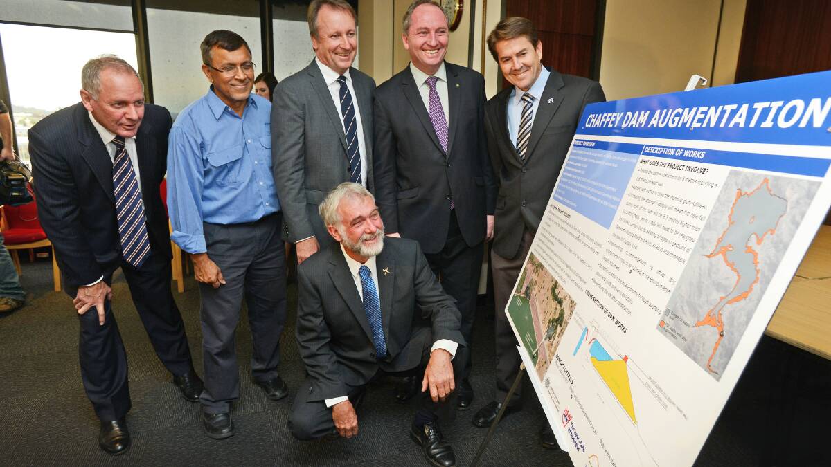 MOMENTOUS DAY: John Holland business development manager Gary Pullar, State Water project manager Jubrahil Khan, Barwon MP Kevin Humphries, Tamworth deputy mayor Russell Webb, New England MP Barnaby Joyce and Tamworth MP Kevin Anderson pore over plans for the $50 million upgrade to Chaffey Dam. Photo: Barry Smith 300514BSC13
