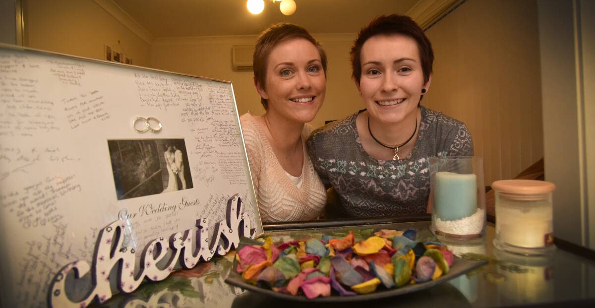TO LOVE AND TO CHERISH: Recently married Sarah Mayo and Lucy McCowen are buoyed by the swell of support for equal marriage rights. Photo: Geoff O’Neill 300615GOE01