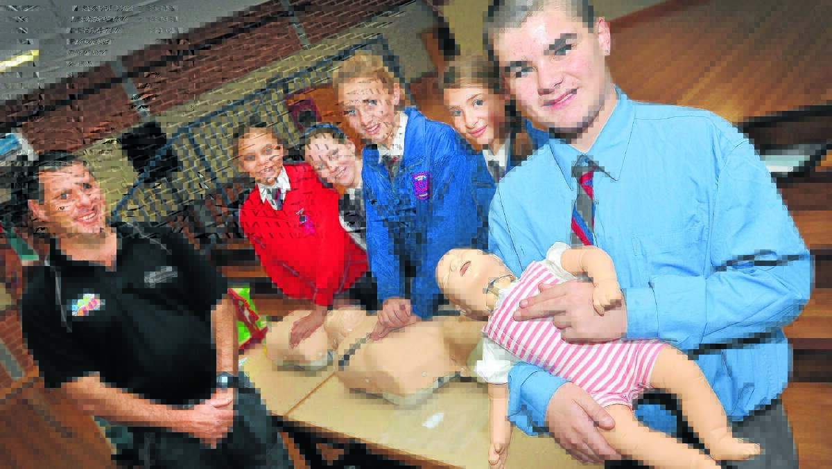 SKILL FOR LIFE: Cameron McFarlane, left, teaches CPR to West Tamworth Public Schoolstudents Lameka English, Emily Pring, Mikayla Gross, Shakira Hurst and Maxwell Higgins. 160714GGA01