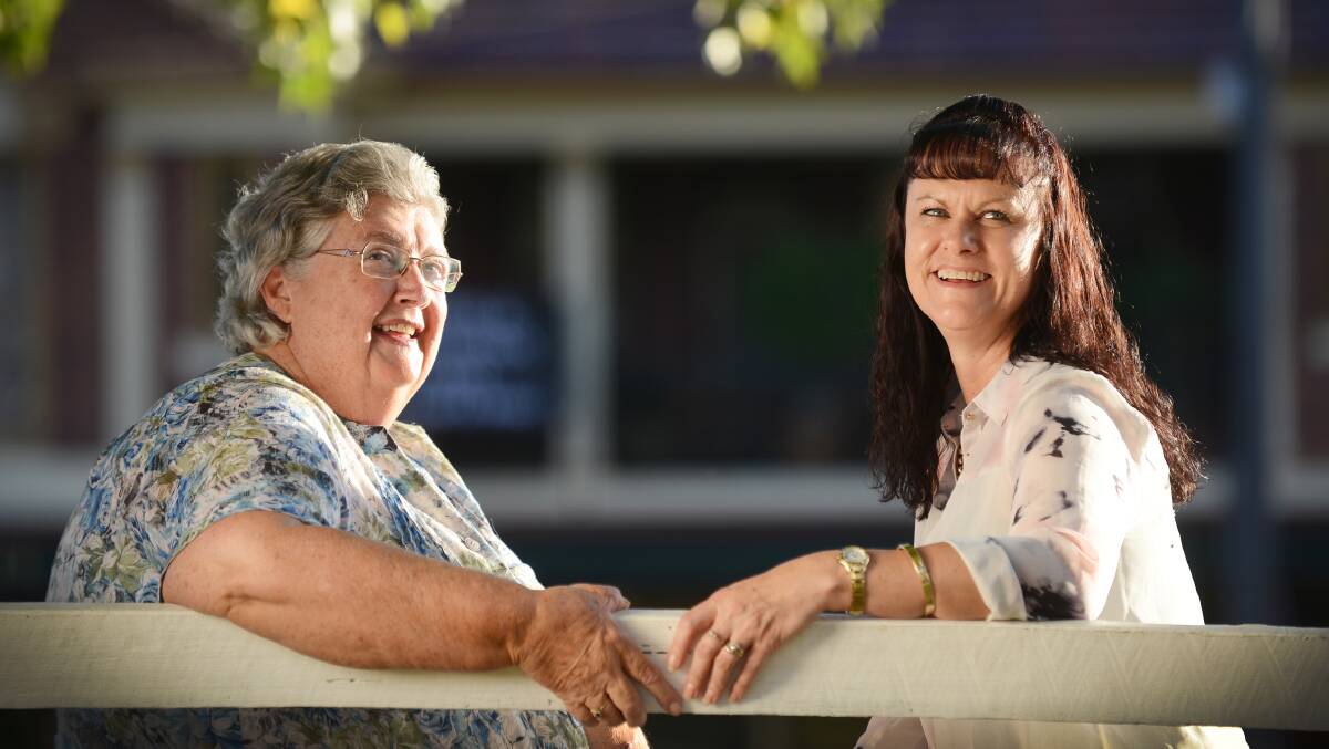 HELPING HAND: Friends of Nioka volunteer Christine Seery and Janelle Rickard, whose husband, Darren, passed away in January, discuss the challenges of coping with grief ahead of a series of workshops in Tamworth this month. Photo: Barry Smith 280414BSD04