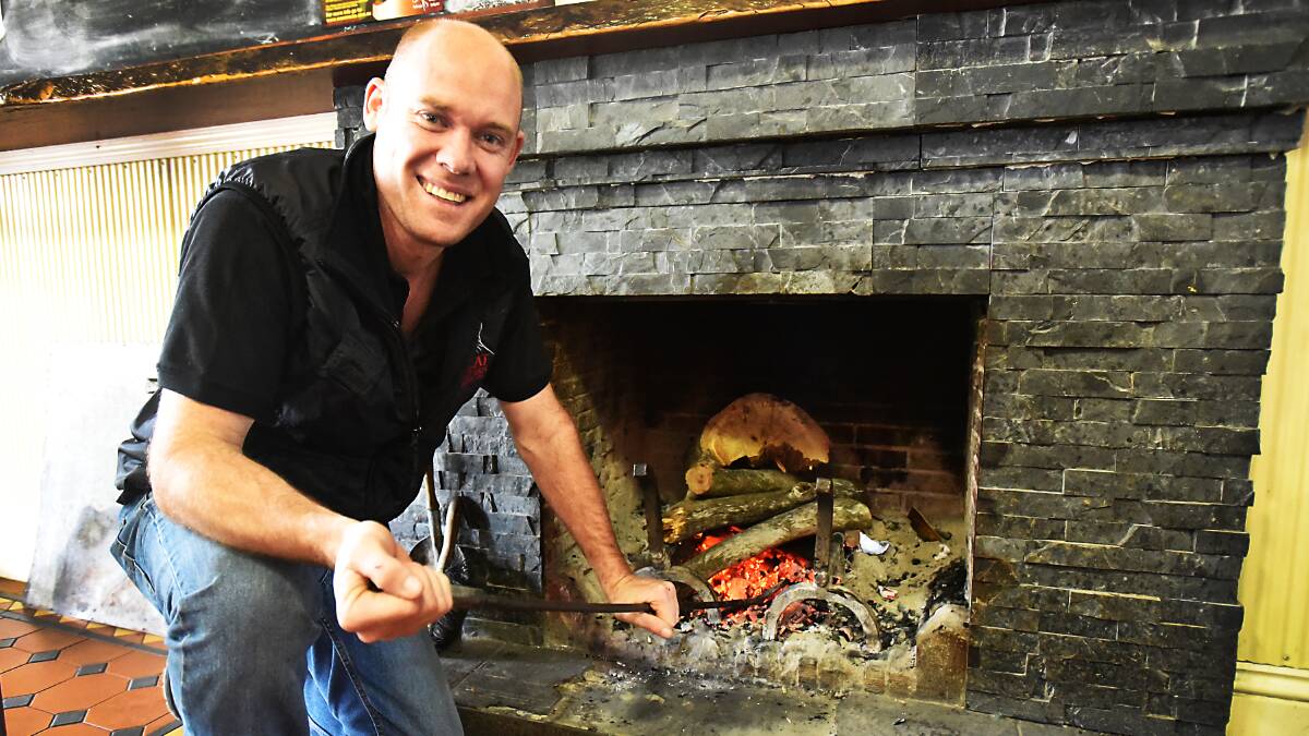 SNOW BELLS JINGLING: The Peel Inn’s Nathan Schofield is hosting cold-weather Christmas celebrations with a hot menu, a roaring fire and plenty of warm hospitality on offer. Photo: Geoff O’Neill 280515GOG01