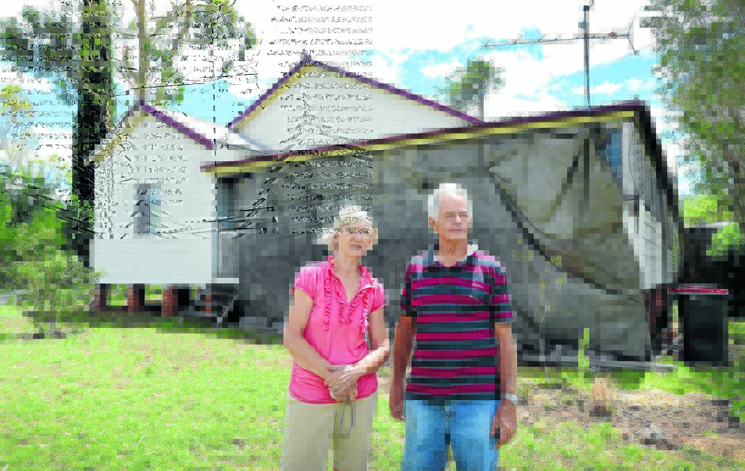 WILD WEATHER: The louvre windows at the front of Margaret and Geoff Webster’s home felt the sting of Thursday afternoon’s storm, as did a shed at the rear of a property. Photo: Barry Smith 121214BSA01
