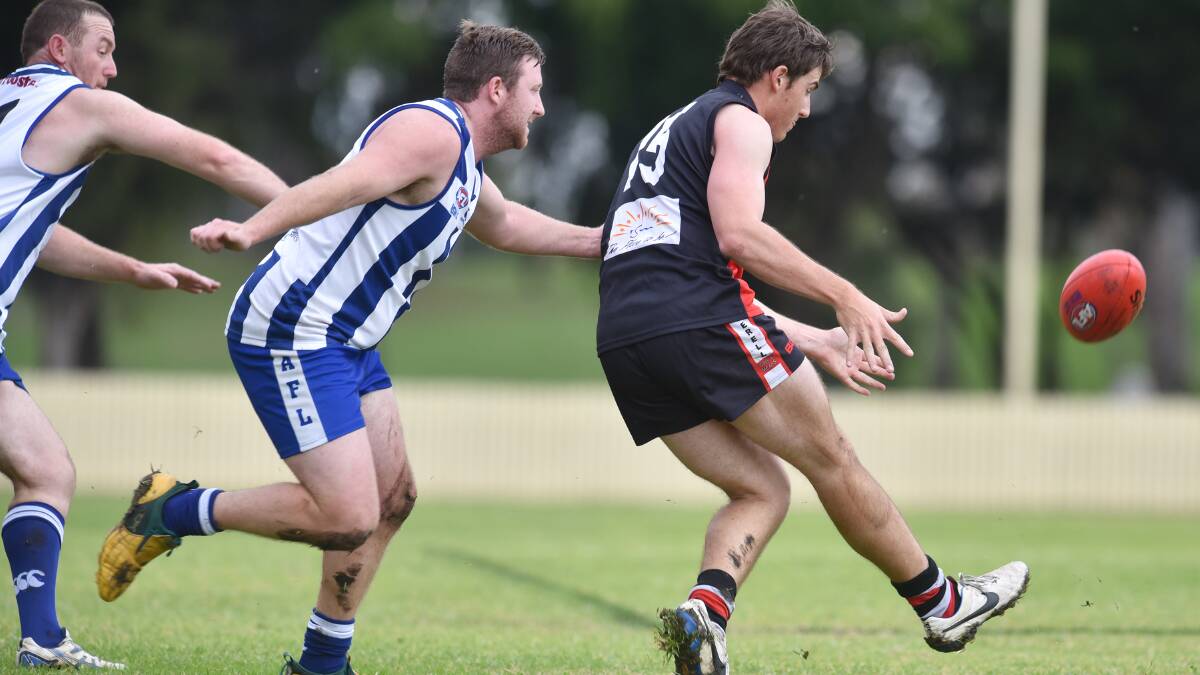 Hayden 
Chappel boots the Saints onto the attack against the Tamworth Kangaroos earlier this season. Tomorrow he leads the Saints back to Tamworth to tackle the Swans while Ben Evenis (left) and his Roos head to Gunnedah to play the Bulldogs. Photo: Barry Smith  300515BSD17