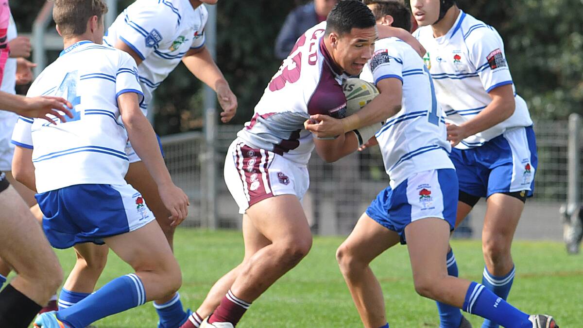 Queensland White’s Zac Lomax and Daniel Fifita look for an offload from Conrad Edwards as NSWCCC’s Curtis Wilson and Josh Delailoa look to put him down. It will be an all Queensland final for the first year ever following two semi-final wins yesterday. Photo: Geoff O’Neill 250614GOE03