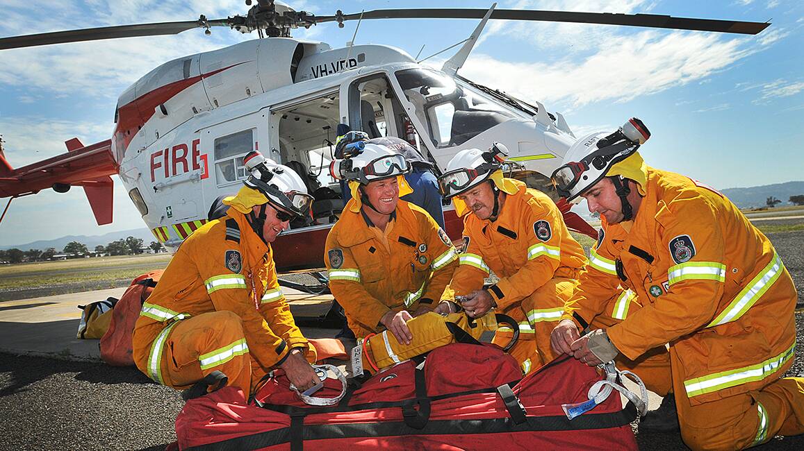 READY AND ABLE: The Rapid Aerial Response Team crew on standby in Tamworth, from left, Peter Stevenson, Allen Madden, Jim Crosbie and  Kendall Thompson, Photo:Geoff O’Neill 271014GOA01