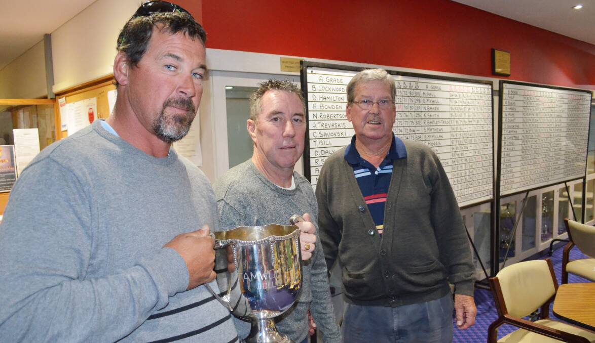 Dave Hamilton holds the Tamworth Club Champion trophy for a second time with sponsor, Choices Flooring representative David Russell (centre), and club captain Ken Mundy. Photo: Chris Bath 240515CBA02