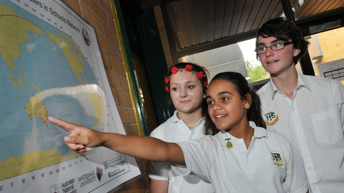 THERE WE ARE: Peel High students, 
from left, Mia Vermeulen, Janaya Lamb and Nathan Todd, point to the school’s 
location on a map of school-based
seismometers around Australia.  
Photo: Gareth Gardner 280214GGD03