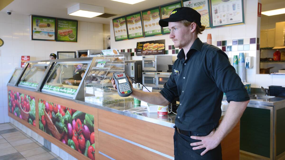 DISCONNECTED: Co-franchisee of Tamworth's Subway stores Luke Fielding says the businesses have been left tens of thousands out of pocket after its phone and internet lines were cut last week. Photo: Barry Smith 080514BSE03