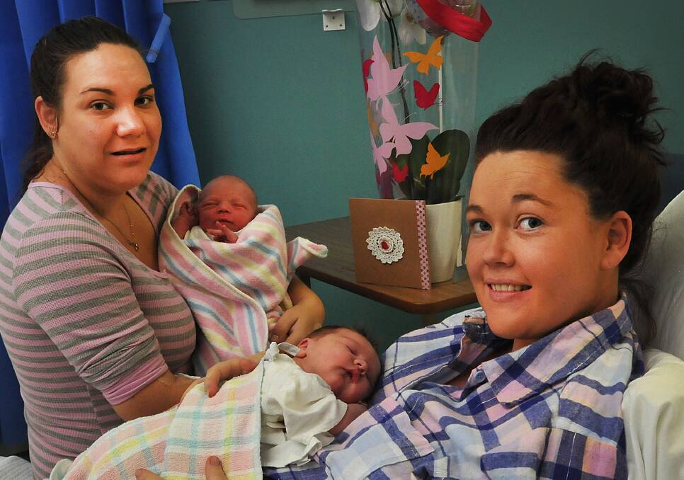 PERFECT TIMING: New mums Sarah Davis, with her son Payton Darcy Langenbaker, and Sarah McKellar, with her daughter Maycie Anne McDonald, celebrate a Mother’s Day they will never forget. Photo: Geoff O’Neill 110514GOD01