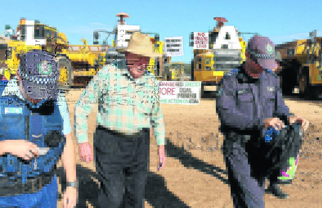 OUTRAGE: Environmentalists have accused NSW Police and the Forestry Corporation of bowing to pressure from mining companies and ordering the closure of several state forests. The closures were enacted after about 80 people, including 92-year-old World War II veteran Bill Ryan, above centre, were arrested on Monday.